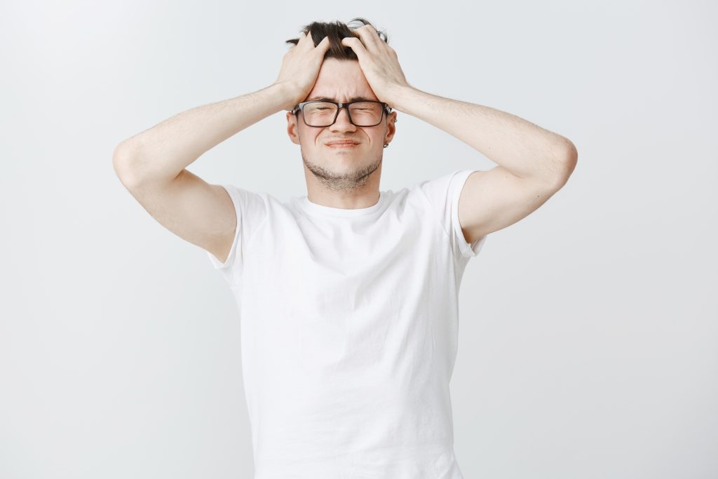 troubled exhausted young man grab head close eyes from overthinking1